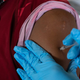 A patient receiving a coronavirus vaccine from the Oakland County Health Department clinic in Southfield, Michigan, in August 2021.